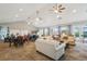 Social gathering room with several tables and seating in clubhouse at 3595 E 124Th Pl, Thornton, CO 80241