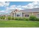 Beautiful home exterior with stone details, green grass, and landscaping at 3595 E 124Th Pl, Thornton, CO 80241