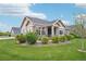 Charming single-story home with stone accents, lush landscaping, and a well-manicured lawn at 3595 E 124Th Pl, Thornton, CO 80241