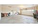 Spacious garage with concrete floor and white door to the interior at 3595 E 124Th Pl, Thornton, CO 80241