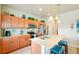 Modern kitchen with a center island, stainless steel appliances, and ample storage at 3595 E 124Th Pl, Thornton, CO 80241
