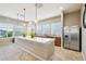 Modern kitchen featuring stainless steel appliances, large island, and ample counter space at 3595 E 124Th Pl, Thornton, CO 80241