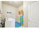 Practical laundry room featuring modern washer and dryer, storage and stylish decor at 3595 E 124Th Pl, Thornton, CO 80241