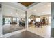 Spacious lounge area with ample seating, stone fireplace and access to outdoor seating at 3595 E 124Th Pl, Thornton, CO 80241
