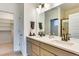 Bright bathroom with double sinks, modern fixtures, and walk-in shower at 6770 Zebra Grass Ln, Parker, CO 80138