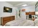 Bedroom with a large window, dresser, closet, and comfy bedding at 6770 Zebra Grass Ln, Parker, CO 80138