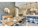 Dining area showcases stylish decor and a seamless transition to the modern kitchen and living room at 6770 Zebra Grass Ln, Parker, CO 80138