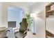 Comfortable home office with large lamp, ergonomic chair, and bookcase, creating a productive work area at 6770 Zebra Grass Ln, Parker, CO 80138