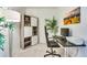 Comfortable office space with desk, printer and shelving, designed to boost productivity with an organized setup at 6770 Zebra Grass Ln, Parker, CO 80138