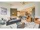 Bright, open-concept living area features stylish furniture and seamless flow to the modern kitchen at 6770 Zebra Grass Ln, Parker, CO 80138