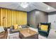 Comfortable living room featuring plush sofas, classic decor, and soft lighting, creating a cozy and inviting atmosphere at 6770 Zebra Grass Ln, Parker, CO 80138
