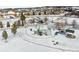 Winter scene of a snow-covered playground with swings, slides, and a gazebo for Gathering fun at 6770 Zebra Grass Ln, Parker, CO 80138