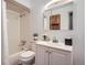 Bright bathroom with a tub and shower combination, white vanity, and medicine cabinet at 2648 S Wadsworth Way, Lakewood, CO 80227