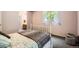 Cozy bedroom with lilac walls, plush carpeting, and backyard window view at 2648 S Wadsworth Way, Lakewood, CO 80227