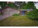 Charming home with a well-maintained lawn, two-car garage, and inviting blue front door at 2648 S Wadsworth Way, Lakewood, CO 80227