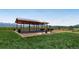 Open-air picnic pavilion featuring tables, grills, and scenic views of the surrounding landscape at 2648 S Wadsworth Way, Lakewood, CO 80227