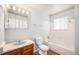 Well-lit bathroom with a tub-shower combo, a vanity with storage, and modern fixtures at 16835 E Harvard Pl, Aurora, CO 80013