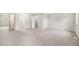 Large bedroom featuring neutral colored walls, carpet and access to other areas in the home at 16835 E Harvard Pl, Aurora, CO 80013