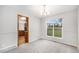 Dining room with neutral carpet, natural light, and an open doorway to kitchen at 16835 E Harvard Pl, Aurora, CO 80013