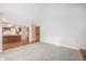 Open-concept living room with carpet, fireplace, and views of the kitchen with hardwood floors at 16835 E Harvard Pl, Aurora, CO 80013
