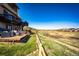 Lovely back deck area with nice furniture and clear views of the open green space and a walking trail at 4968 Montvale Dr, Highlands Ranch, CO 80130