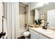 Well-lit bathroom with a shower-tub combo, a white vanity, and neutral tones at 4968 Montvale Dr, Highlands Ranch, CO 80130