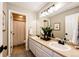 Bright bathroom with a double sink vanity, large mirror, and a separate shower and toilet area at 4968 Montvale Dr, Highlands Ranch, CO 80130