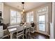 Charming breakfast nook with natural light, cozy seating, and an exterior door to the deck at 4968 Montvale Dr, Highlands Ranch, CO 80130
