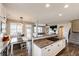 Open kitchen with granite countertops, a gas cooktop, and seamless flow to the breakfast nook at 4968 Montvale Dr, Highlands Ranch, CO 80130