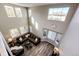 Spacious living room with a high ceiling and many windows, offering abundant natural light at 4968 Montvale Dr, Highlands Ranch, CO 80130