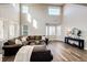 Bright living room with large windows, modern decor, and elegant wood floors at 4968 Montvale Dr, Highlands Ranch, CO 80130
