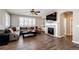 Comfortable living room features a fireplace and built-in shelving, perfect for relaxation at 4968 Montvale Dr, Highlands Ranch, CO 80130