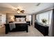 Inviting main bedroom with a ceiling fan, dark furniture, and plush bedding at 4968 Montvale Dr, Highlands Ranch, CO 80130