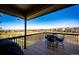 Covered patio offering views of the neighborhood with an outdoor seating area and a blue sky at 4968 Montvale Dr, Highlands Ranch, CO 80130