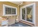 Rear patio with a window and sliding glass door at 15912 E Dakota Pl # C, Aurora, CO 80017