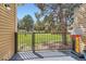 Back porch overlooking a lush lawn with mature trees at 15912 E Dakota Pl # C, Aurora, CO 80017