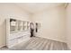 This bedroom features carpet, an organizational shelf unit, and a closet with hanging storage space at 15912 E Dakota Pl # C, Aurora, CO 80017