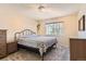 Cozy bedroom with neutral carpet and a comfortable bed and natural light from the window at 15912 E Dakota Pl # C, Aurora, CO 80017