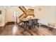 Dining room features a wood table with chairs, wooden stairs, and hardwood flooring at 15912 E Dakota Pl # C, Aurora, CO 80017