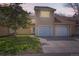 Inviting townhome featuring an attached garage and well-maintained lawn at 15912 E Dakota Pl # C, Aurora, CO 80017