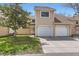 Inviting townhome featuring an attached garage and well-maintained lawn at 15912 E Dakota Pl # C, Aurora, CO 80017