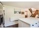 Kitchen features an island with white countertops and stairs leading to the second floor at 15912 E Dakota Pl # C, Aurora, CO 80017