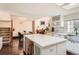 Bright kitchen features an island, stainless steel appliances, and dark hardwood floors at 15912 E Dakota Pl # C, Aurora, CO 80017