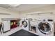 The laundry room offers a sink, counter space, and newer appliances at 15912 E Dakota Pl # C, Aurora, CO 80017