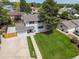Aerial view of home showing landscaped lawn, mature trees, and neighborhood setting at 3193 W 134Th Cir, Broomfield, CO 80020