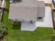 Aerial view of home's roof, backyard, and driveway surrounded by mature trees at 3193 W 134Th Cir, Broomfield, CO 80020