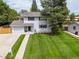 Aerial view of home showing landscaped lawn, mature trees, and neighborhood setting at 3193 W 134Th Cir, Broomfield, CO 80020