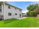 Green backyard with a well-manicured lawn, patio, and privacy fence for outdoor enjoyment at 3193 W 134Th Cir, Broomfield, CO 80020