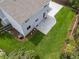 Aerial view of the backyard with a patio and lawn, surrounded by mature trees at 3193 W 134Th Cir, Broomfield, CO 80020