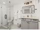 Bathroom with a grey vanity, glass shower door and black hardware at 3193 W 134Th Cir, Broomfield, CO 80020
